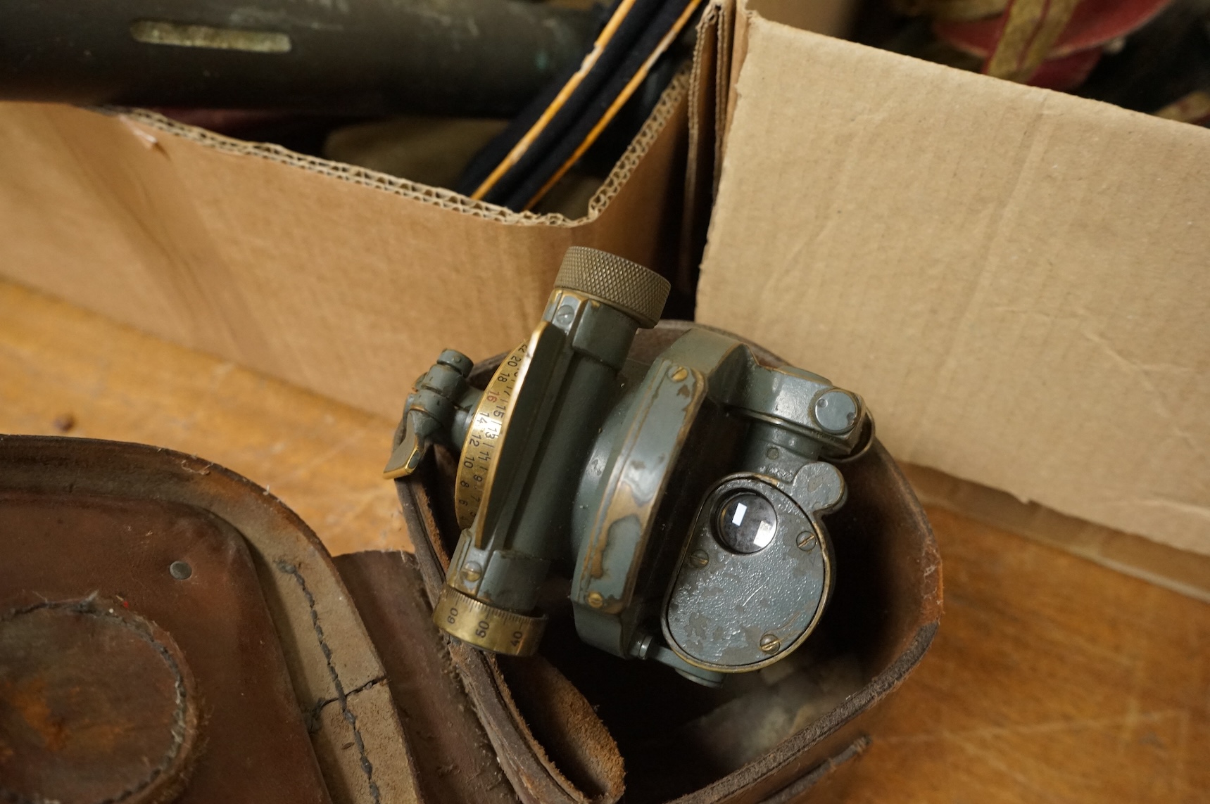 A collection of militaria including; a US Air Force camera Type N-6, a leather cased Bell & Howell Sportster camera and accessories, a pair of periscope binoculars, a leather cased compass by Goerz, Berlin